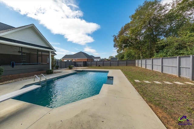 view of pool with a sunroom and a lawn