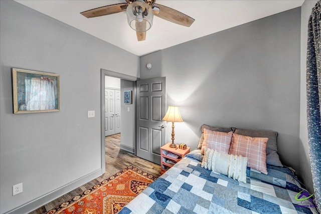 bedroom with ceiling fan and light hardwood / wood-style floors