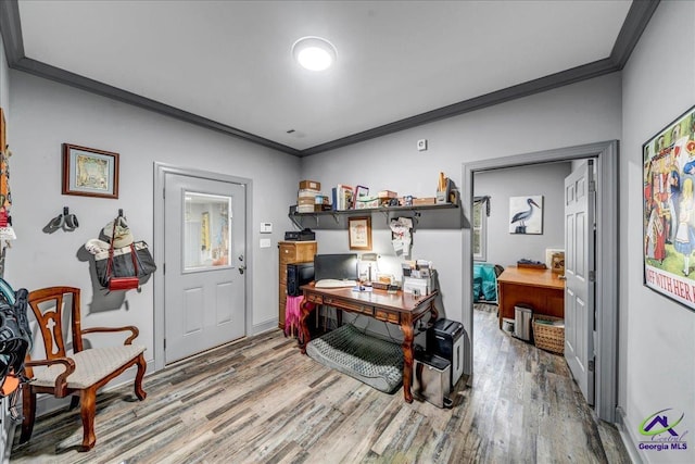 office area featuring hardwood / wood-style flooring and ornamental molding