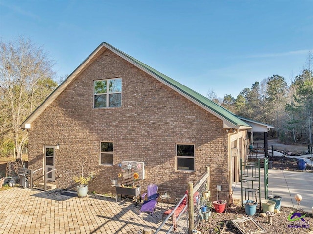 view of home's exterior with a patio area