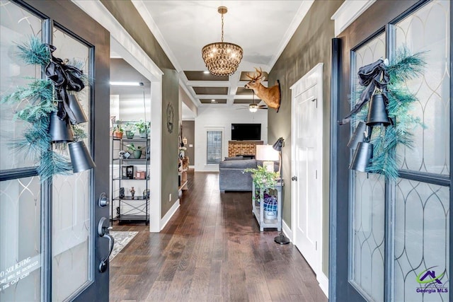 entryway with dark hardwood / wood-style flooring, coffered ceiling, ceiling fan with notable chandelier, crown molding, and beamed ceiling