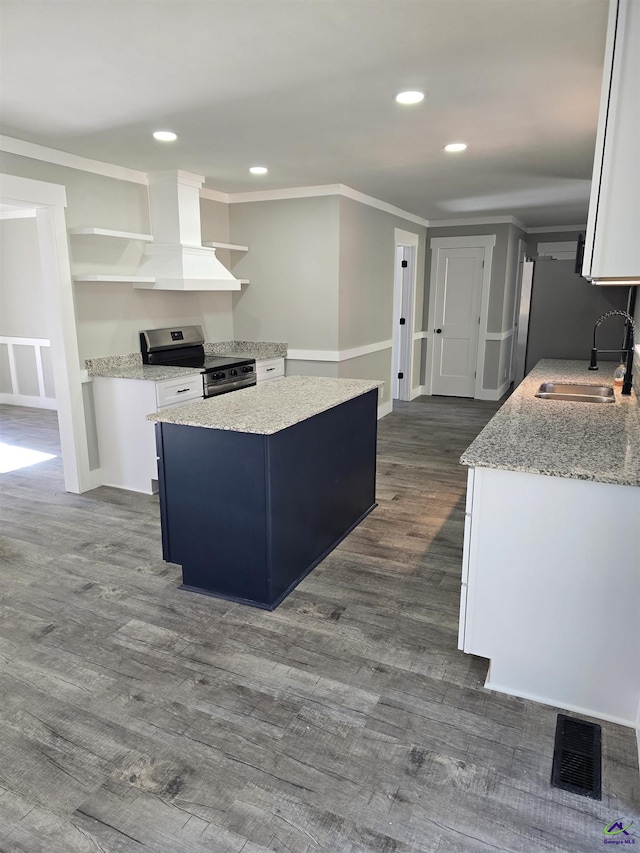 kitchen featuring sink, dark wood-type flooring, range hood, stainless steel electric stove, and white cabinets