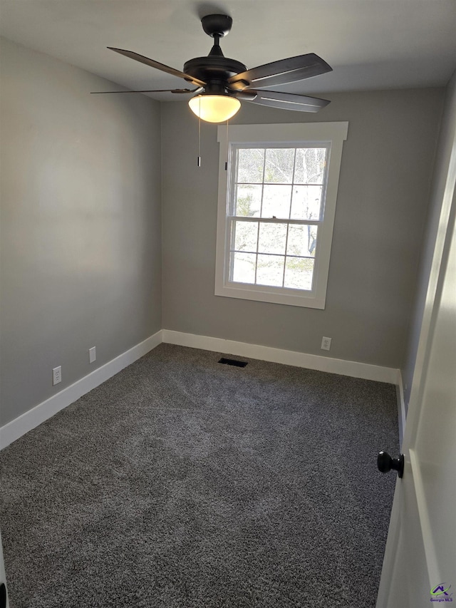 unfurnished room with ceiling fan and carpet floors