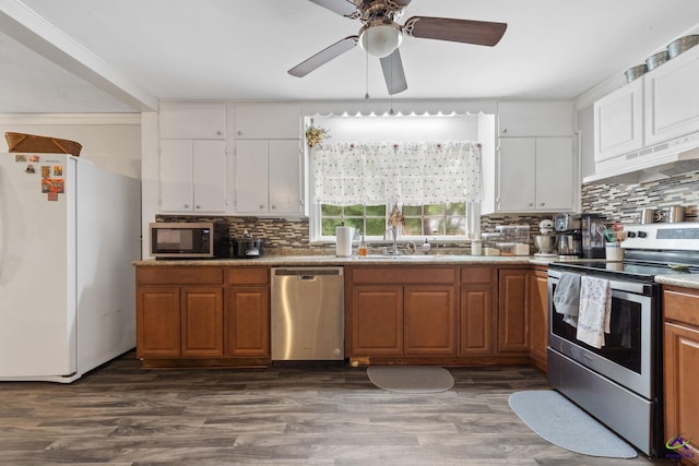 kitchen featuring ceiling fan, dark wood-type flooring, stainless steel appliances, white cabinets, and custom range hood