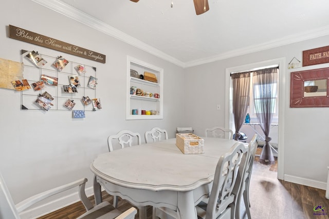 dining space with built in shelves, ceiling fan, crown molding, and dark hardwood / wood-style floors