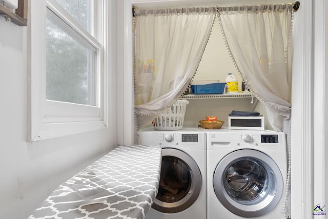 washroom with washing machine and dryer