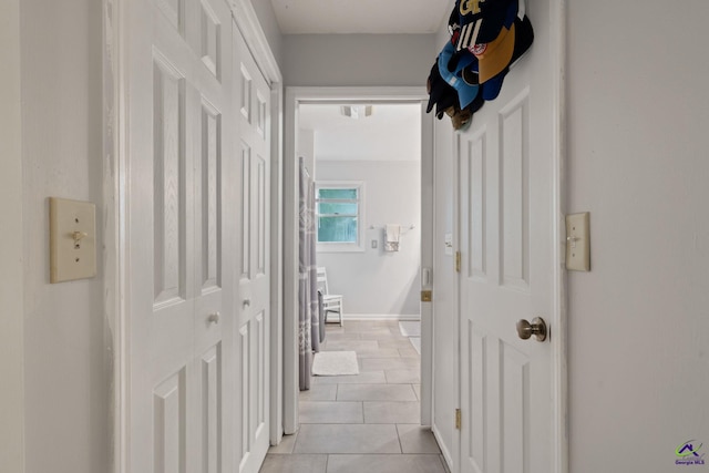 hall with light tile patterned flooring