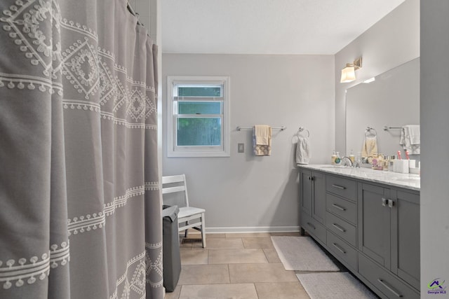 bathroom featuring tile patterned flooring and vanity