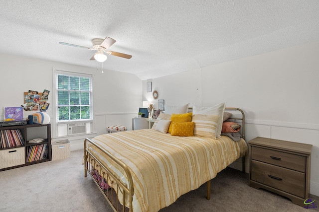 carpeted bedroom with ceiling fan, cooling unit, a textured ceiling, and vaulted ceiling