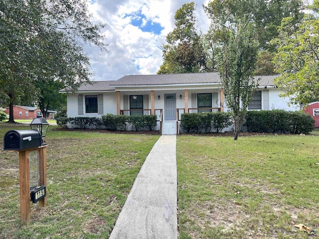 single story home featuring covered porch and a front lawn