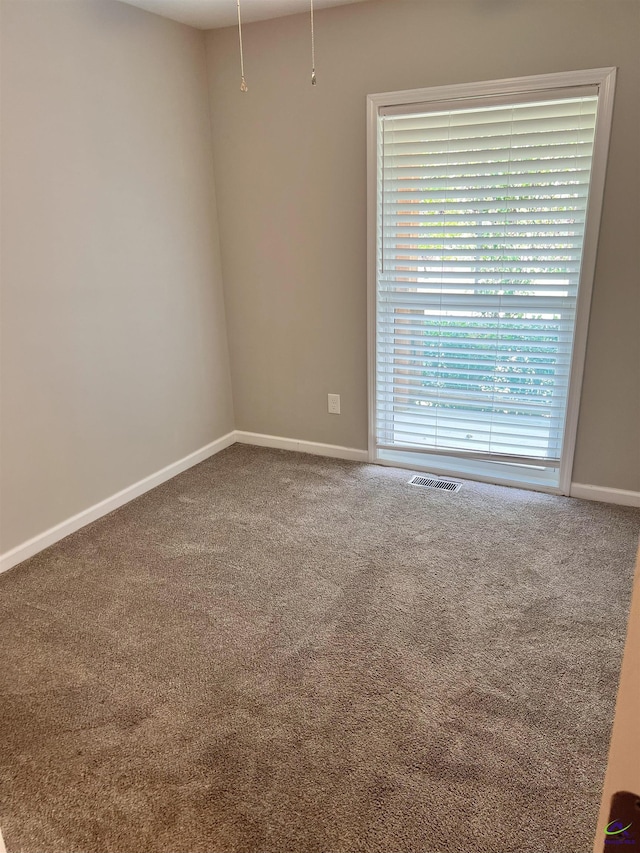 empty room featuring carpet floors