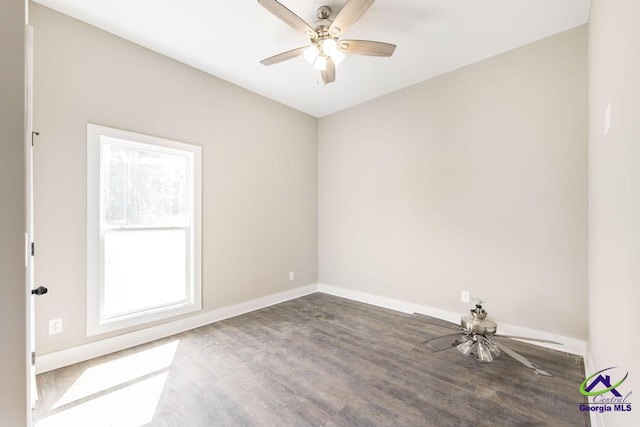 empty room featuring hardwood / wood-style flooring and ceiling fan