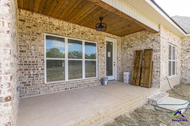 property entrance featuring a patio area