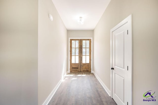 doorway with hardwood / wood-style floors and french doors