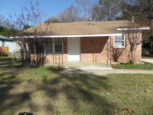 ranch-style house with a front lawn