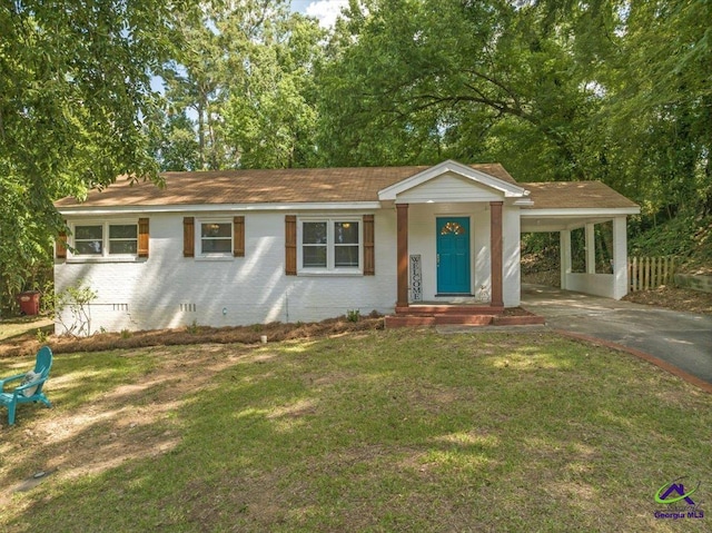 single story home with a front lawn and a carport