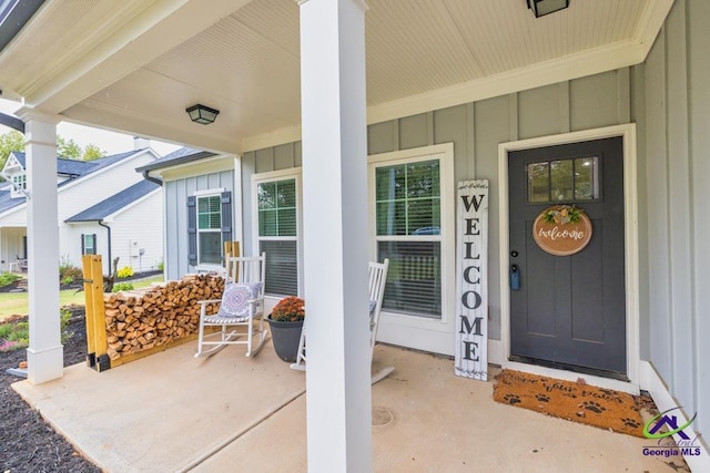 view of exterior entry with covered porch