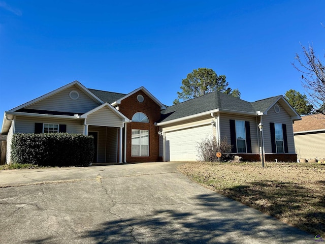 single story home featuring a garage