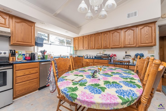 kitchen with stainless steel appliances, vaulted ceiling, and crown molding