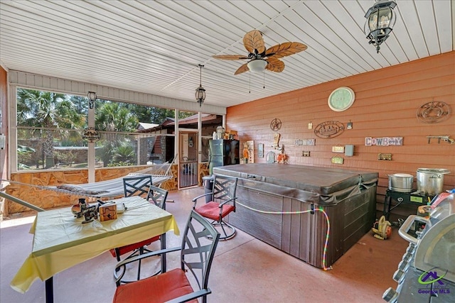 view of patio / terrace with a hot tub and ceiling fan