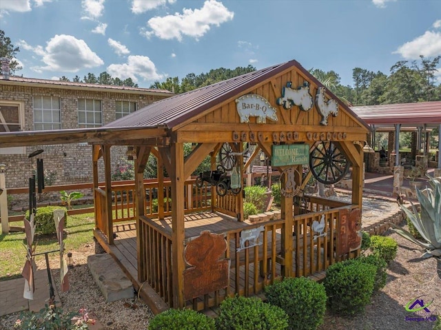 wooden deck featuring a gazebo