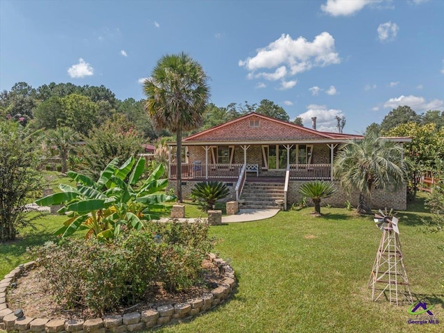 country-style home featuring covered porch and a front yard