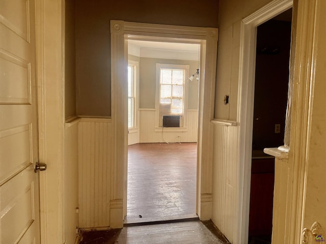 hallway with hardwood / wood-style flooring