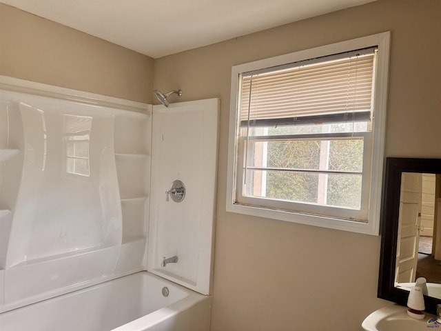 bathroom with bathtub / shower combination and sink