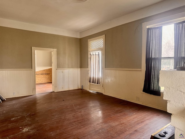 spare room with dark wood-type flooring