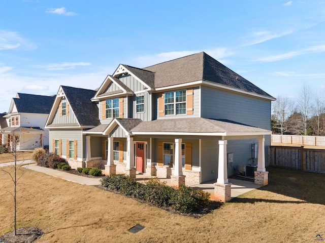 craftsman house featuring a front lawn and covered porch