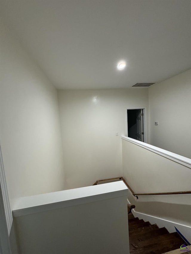 stairway featuring hardwood / wood-style flooring