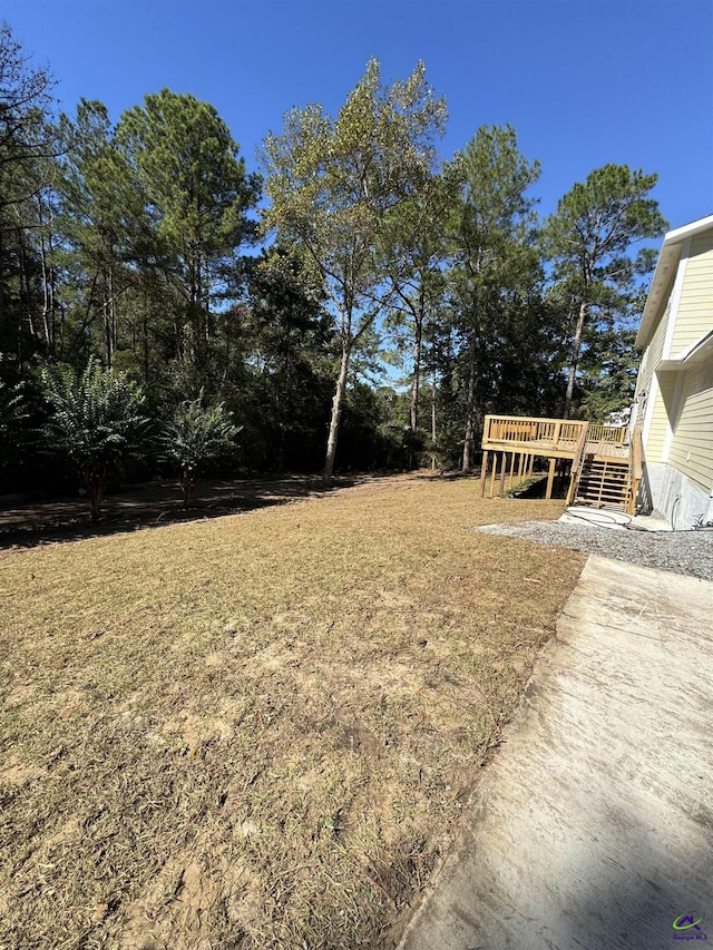 view of yard featuring a wooden deck