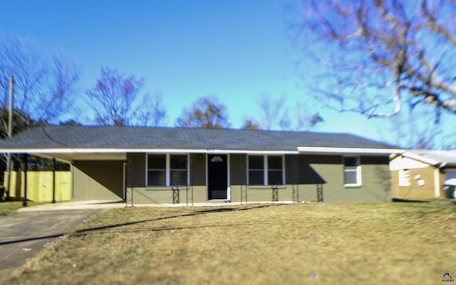 ranch-style home with a carport