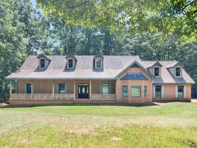 cape cod-style house with a front yard and a porch