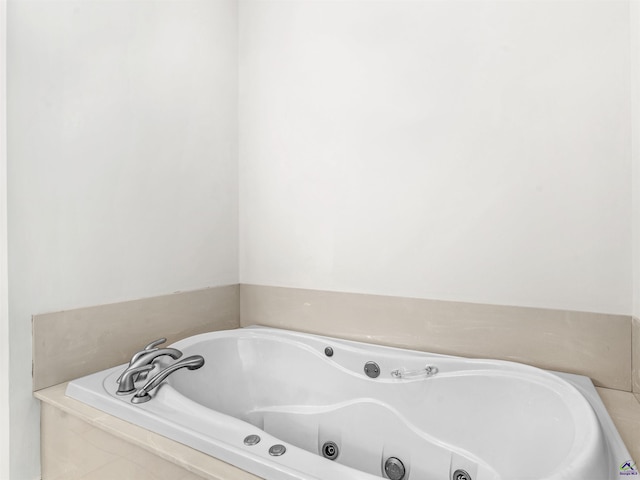 bathroom featuring a relaxing tiled tub