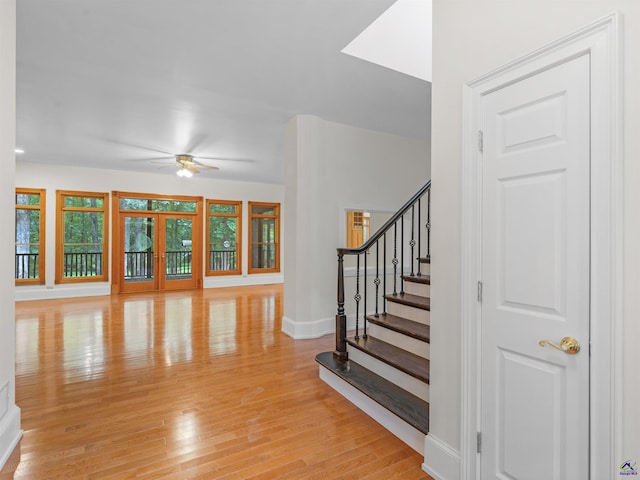 interior space with ceiling fan and light hardwood / wood-style floors