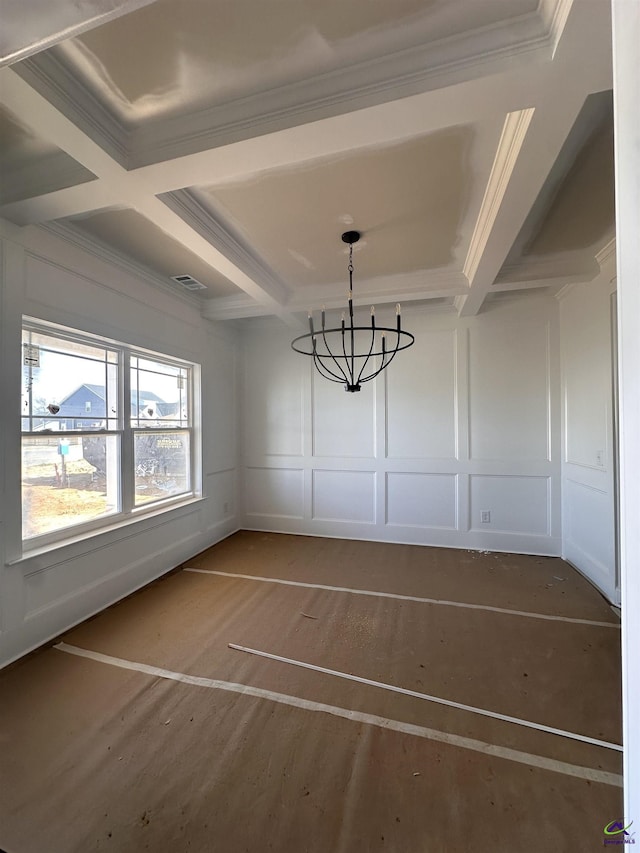 unfurnished dining area with coffered ceiling, wood finished floors, visible vents, and a decorative wall