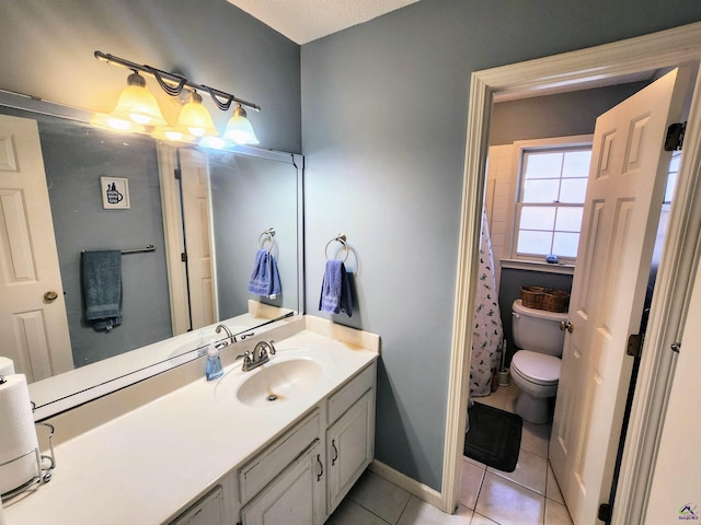 bathroom featuring toilet, vanity, tile patterned floors, and a shower with shower curtain