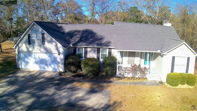 view of front of property featuring a porch and a garage