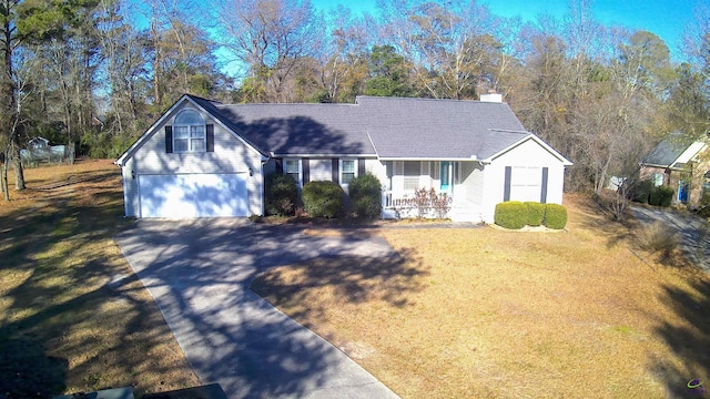 view of front of home featuring a garage and a front lawn