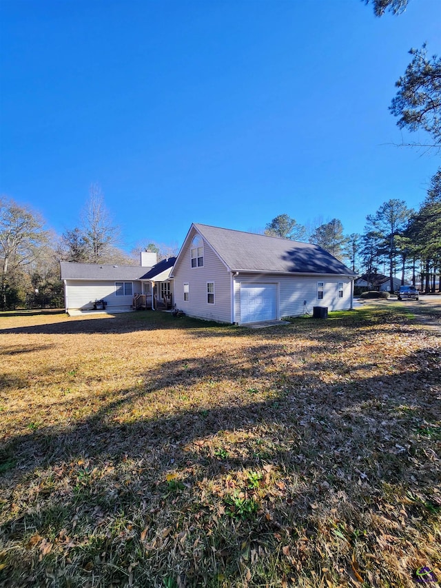 view of property exterior with a lawn