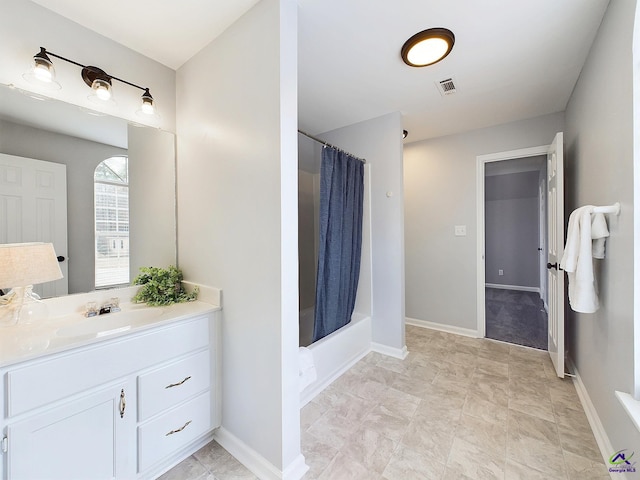 bathroom with vanity and shower / bathtub combination with curtain