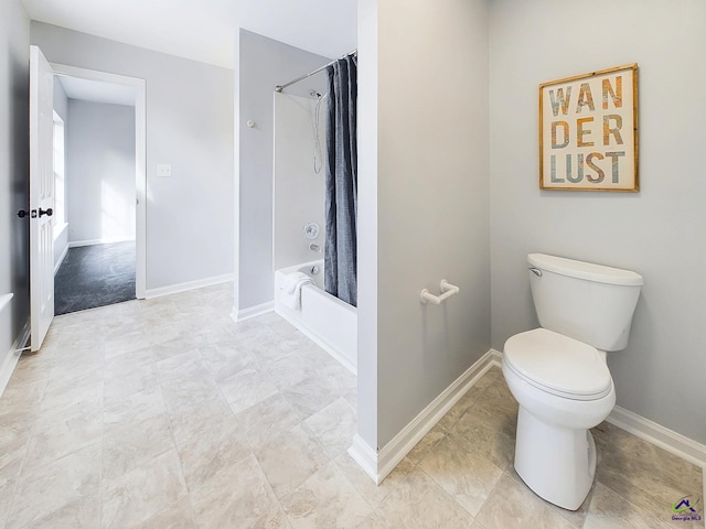 bathroom with shower / bath combo and toilet