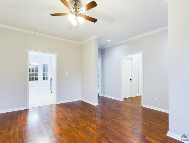 spare room featuring dark hardwood / wood-style floors, ceiling fan, and crown molding