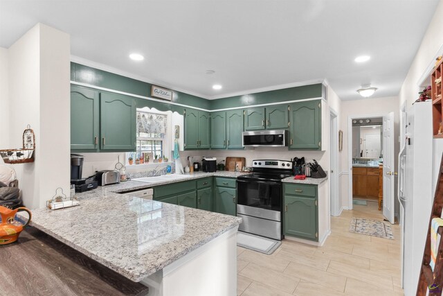 kitchen featuring kitchen peninsula, appliances with stainless steel finishes, and green cabinetry