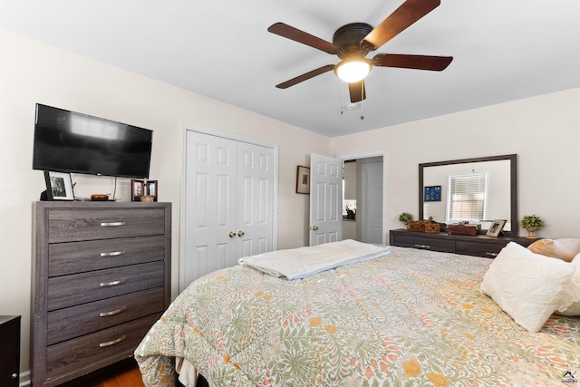 bedroom with ceiling fan and a closet