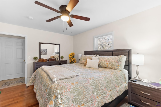 bedroom with hardwood / wood-style flooring and ceiling fan