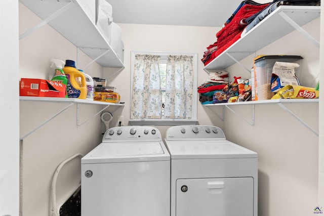 laundry room featuring washing machine and clothes dryer