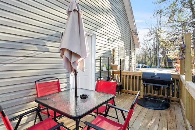 wooden terrace featuring grilling area