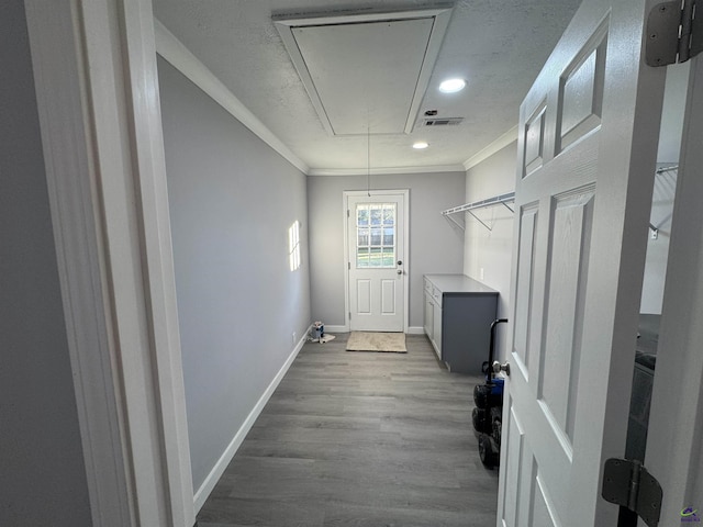 interior space with light hardwood / wood-style floors and ornamental molding